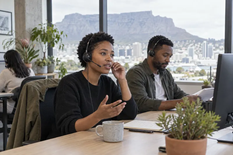 Agents talking between calls in the Cape Town studio